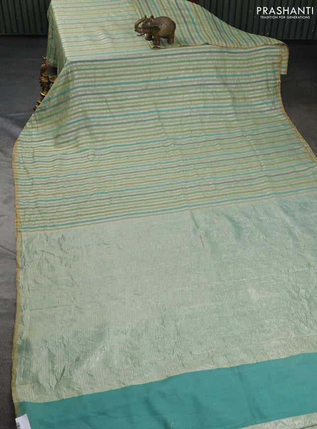 Munga silk saree pastel green with allover zari woven stripes pattern in borderless style