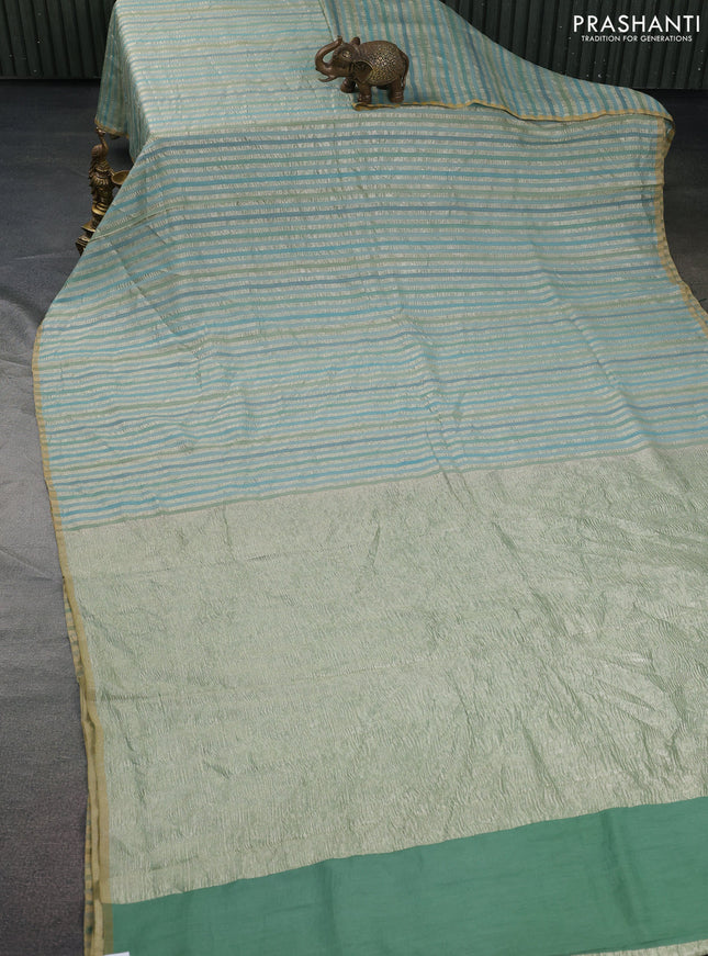 Munga silk saree pastel blue with allover zari woven stripes pattern in borderless style