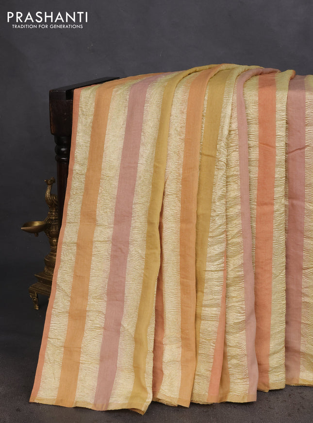 Munga silk saree pale yellow and pale orange with allover zari woven stripes pattern in borderless style