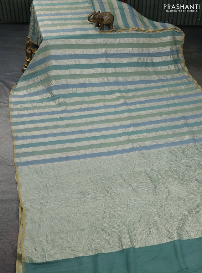 Munga silk saree pastel grey with allover zari woven stripes pattern in borderless style