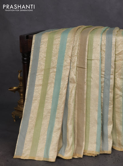 Munga silk saree multi colour with allover zari woven stripes pattern in borderless style