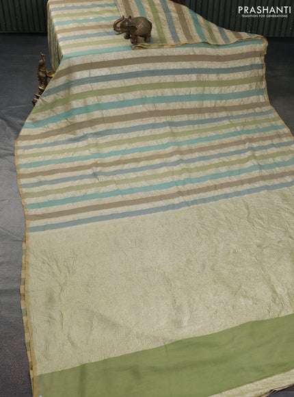 Munga silk saree multi colour with allover zari woven stripes pattern in borderless style