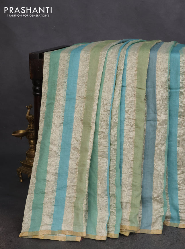 Munga silk saree pastel blue and pastel green with allover zari woven stripes pattern in borderless style