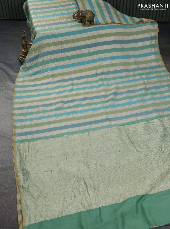 Munga silk saree pastel blue and pastel green with allover zari woven stripes pattern in borderless style