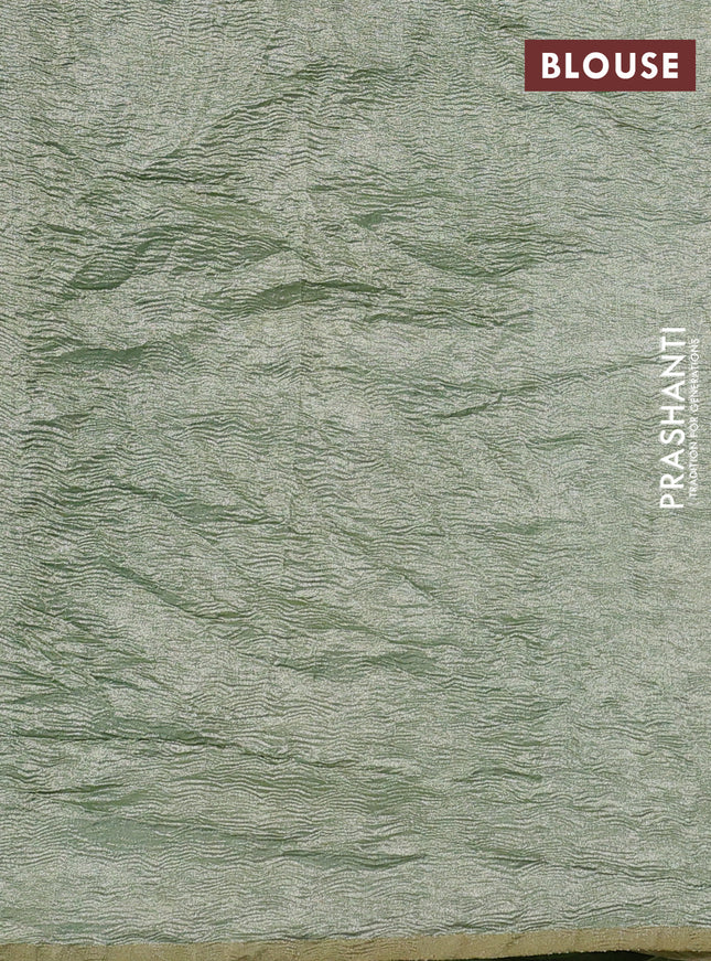 Munga silk saree pastel blue and pastel green with allover zari woven stripes pattern in borderless style