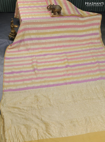 Munga silk saree sandal and multi colour with allover zari woven stripes pattern in borderless style