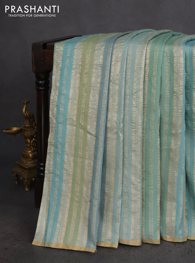 Munga silk saree pastel blue and pastel green with allover zari woven stripes pattern in borderless style