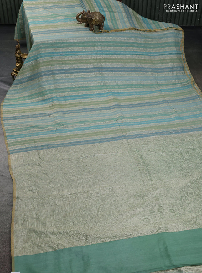 Munga silk saree pastel blue and pastel green with allover zari woven stripes pattern in borderless style