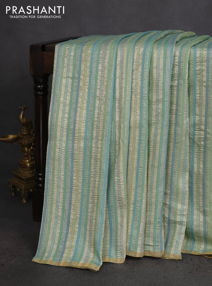 Munga silk saree pastel green and pastel blue with allover zari woven stripes pattern in borderless style