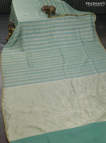 Munga silk saree pastel green and pastel blue with allover zari woven stripes pattern in borderless style