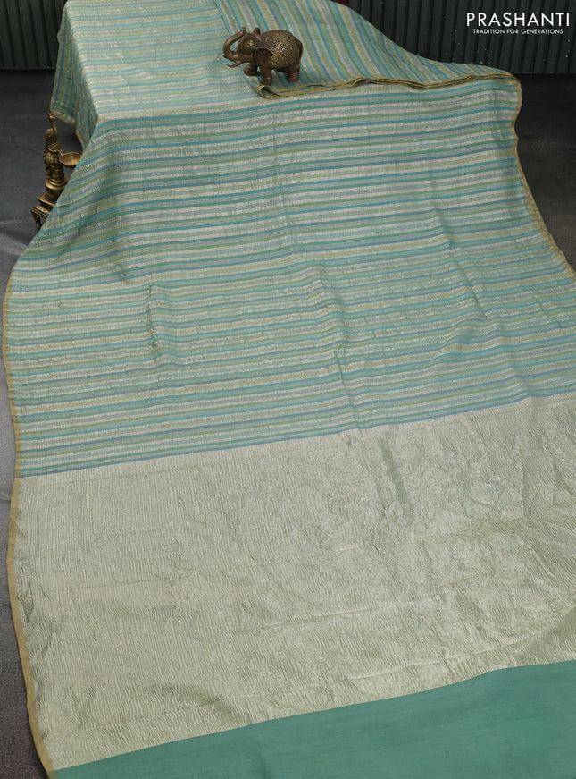Munga silk saree pastel green and pastel blue with allover zari woven stripes pattern in borderless style