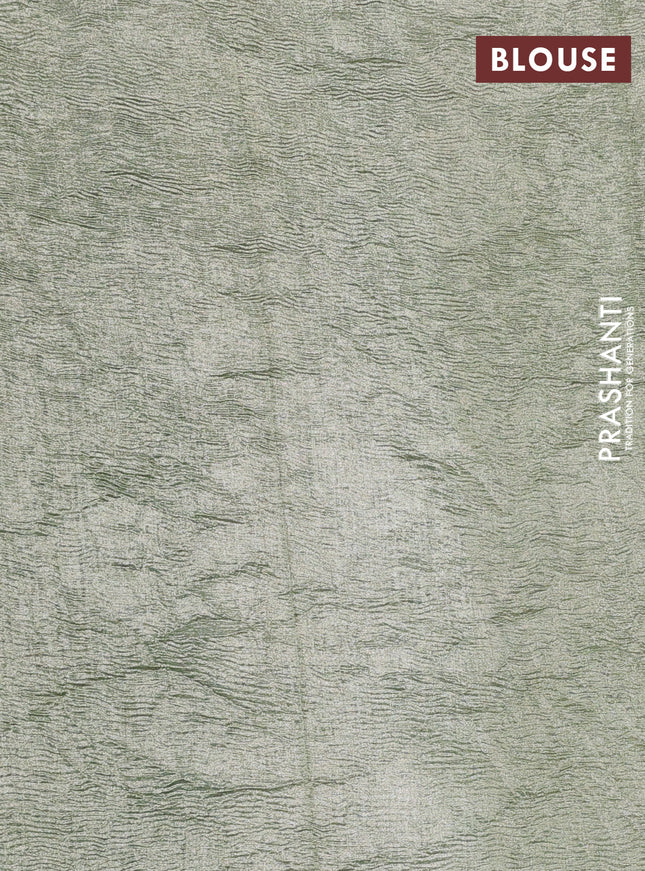 Munga silk saree pastel green and pastel blue with allover zari woven stripes pattern in borderless style