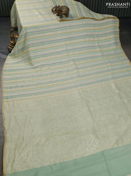 Munga silk saree pastel green and pastel blue with allover zari woven stripes pattern in borderless style