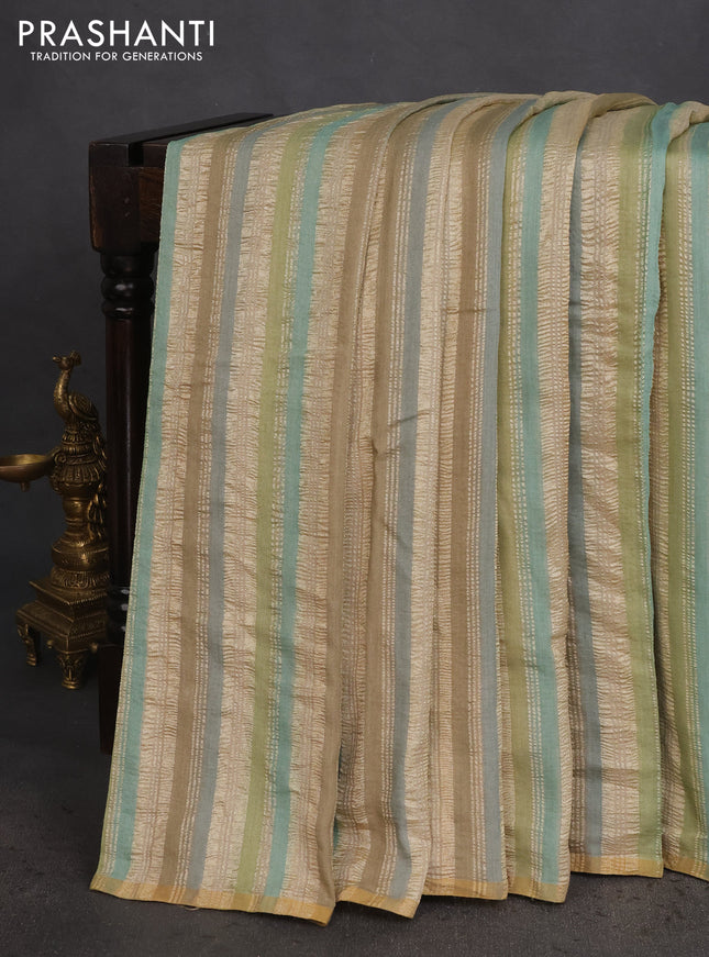 Munga silk saree multi colour with allover zari woven stripes pattern in borderless style