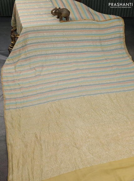 Munga silk saree multi colour with allover zari woven stripes pattern in borderless style