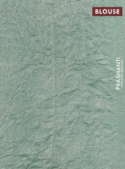 Munga silk saree pastel green with allover zari woven stripes pattern in borderless style