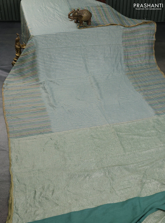Munga silk saree pastel blue with allover zari woven stripes pattern in borderless style