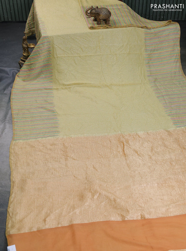 Munga silk saree pale yellow with allover zari woven stripes pattern in borderless style
