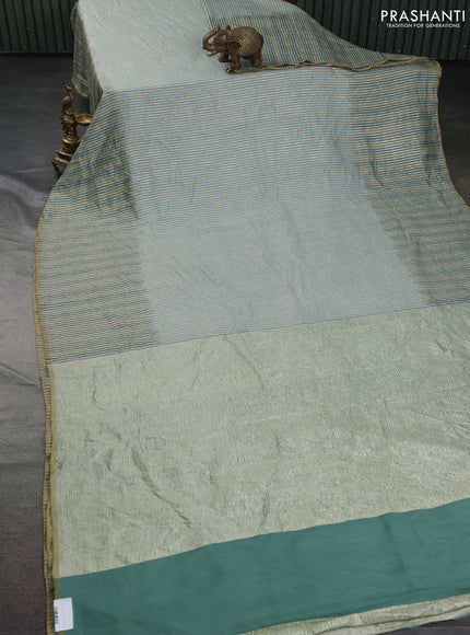 Munga silk saree pastel blue with allover zari woven stripes pattern in borderless style