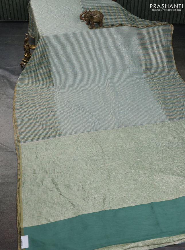 Munga silk saree pastel blue with allover zari woven stripes pattern in borderless style