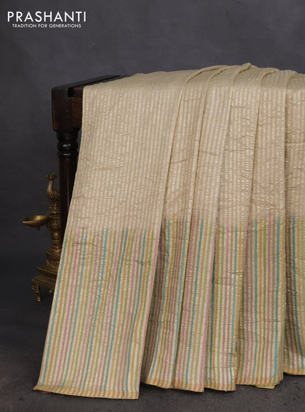 Munga silk saree beige with allover zari woven stripes pattern in borderless style