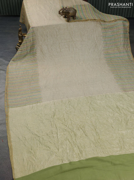 Munga silk saree beige with allover zari woven stripes pattern in borderless style