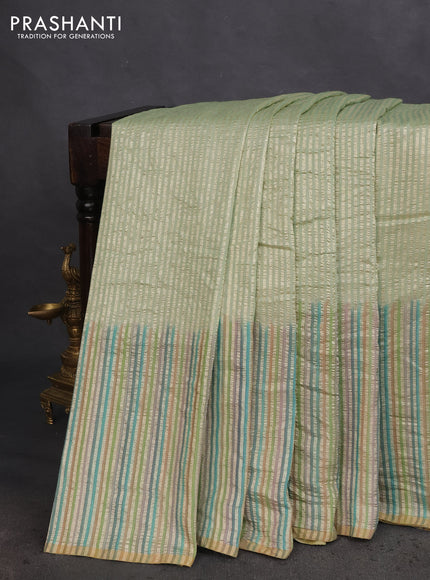 Munga silk saree pastel green with allover zari woven stripes pattern in borderless style