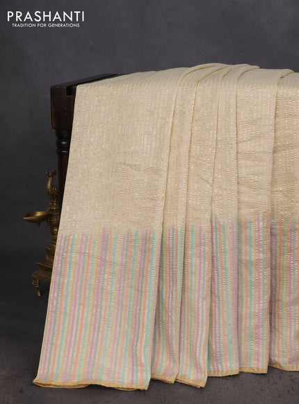 Munga silk saree cream with allover zari woven stripes pattern in borderless style