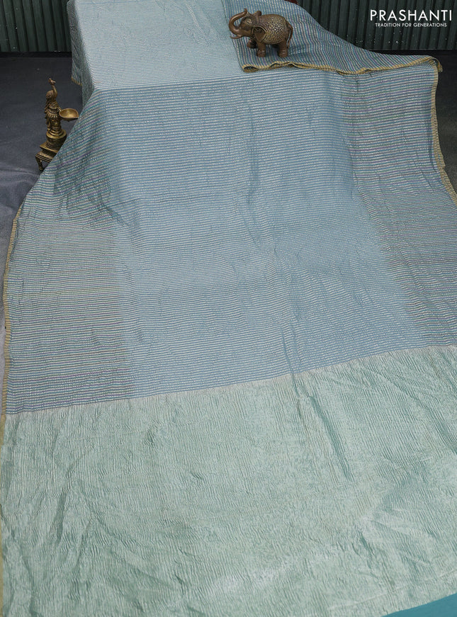 Munga silk saree pastel blue with allover zari woven stripes pattern in borderless style