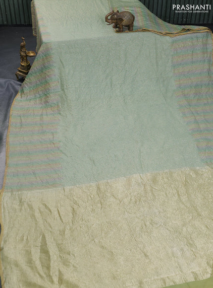 Munga silk saree pastel green and multi colour with allover zari woven stripes pattern in borderless style