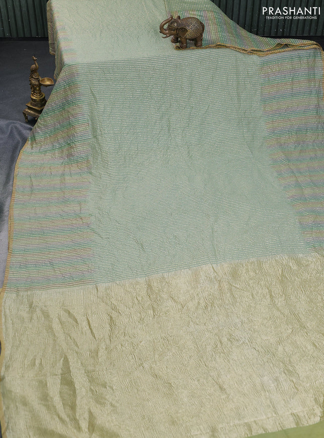 Munga silk saree pastel green and multi colour with allover zari woven stripes pattern in borderless style