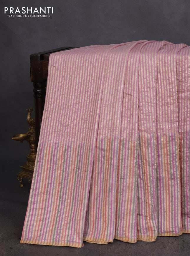 Munga silk saree pastel pink and multi colour with allover zari woven stripes pattern in borderless style