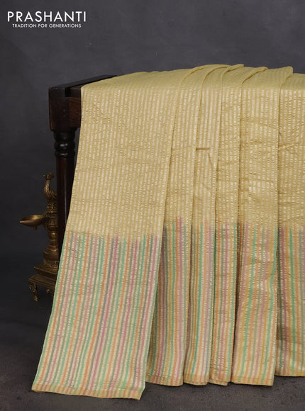 Munga silk saree pale yellow with allover zari woven stripes pattern in borderless style