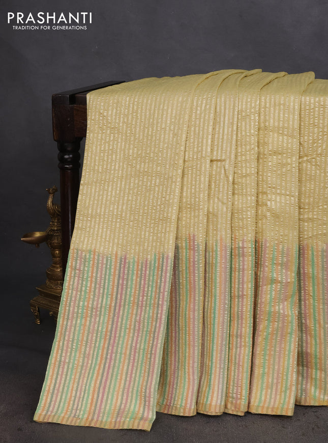 Munga silk saree pale yellow with allover zari woven stripes pattern in borderless style
