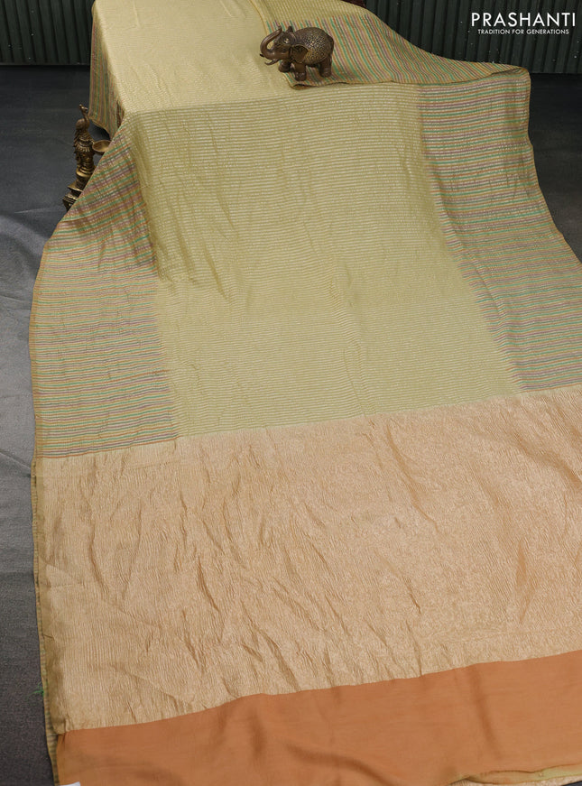 Munga silk saree pale yellow with allover zari woven stripes pattern in borderless style