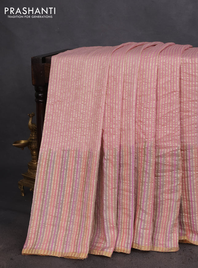 Munga silk saree pastel pink with allover zari woven stripes pattern in borderless style