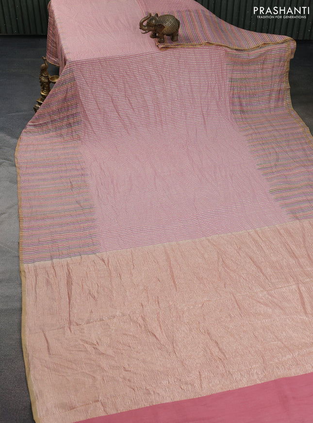 Munga silk saree pastel pink with allover zari woven stripes pattern in borderless style