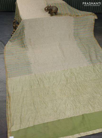 Munga silk saree beige and multi colour with allover zari woven stripes pattern in borderless style