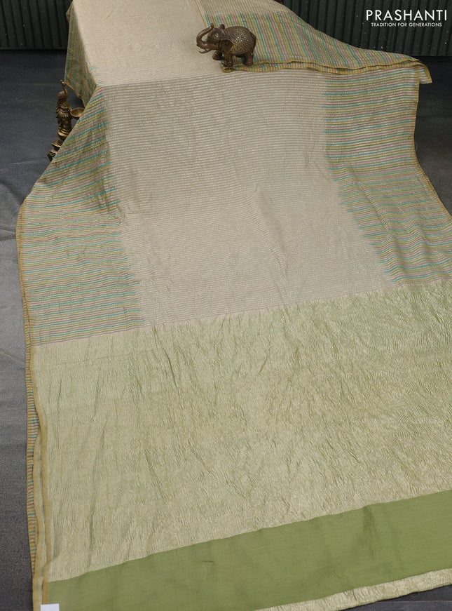 Munga silk saree beige and multi colour with allover zari woven stripes pattern in borderless style