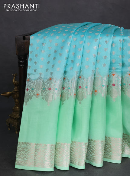 Banarasi poona silk saree teal blue and pastel green with allover silver zari woven buttas and silver long zari woven border