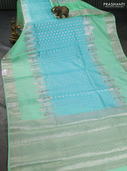 Banarasi poona silk saree teal blue and pastel green with allover silver zari woven buttas and silver long zari woven border