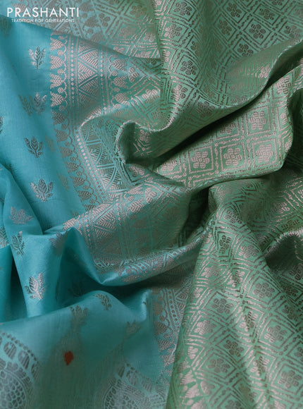 Banarasi poona silk saree teal blue and pastel green with allover silver zari woven buttas and silver long zari woven border
