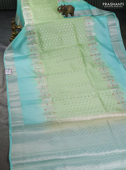 Banarasi poona silk saree light green and teal blue with allover silver zari woven buttas and silver long zari woven border