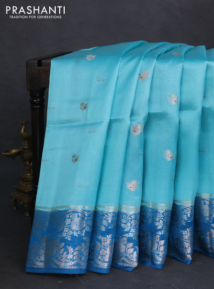Banarasi poona silk saree teal blue and cs blue zari woven floral buttas and silver zari woven border