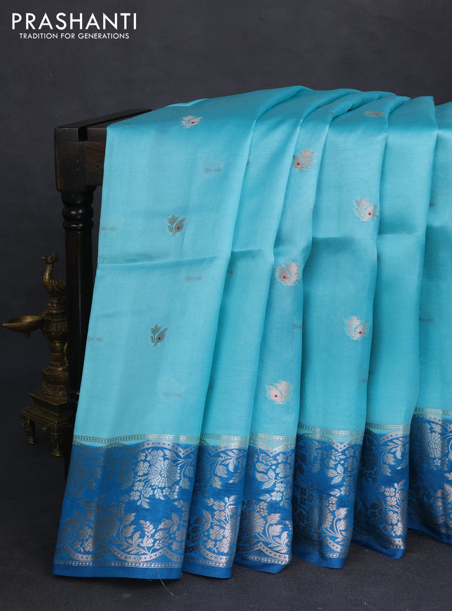 Banarasi poona silk saree teal blue and cs blue zari woven floral buttas and silver zari woven border