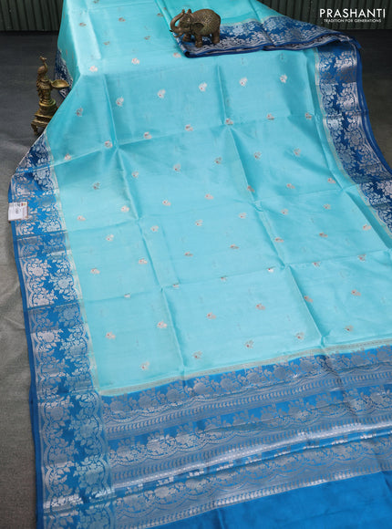 Banarasi poona silk saree teal blue and cs blue zari woven floral buttas and silver zari woven border