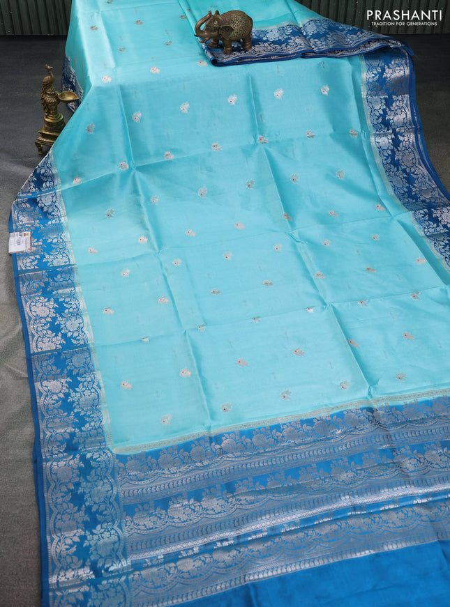 Banarasi poona silk saree teal blue and cs blue zari woven floral buttas and silver zari woven border