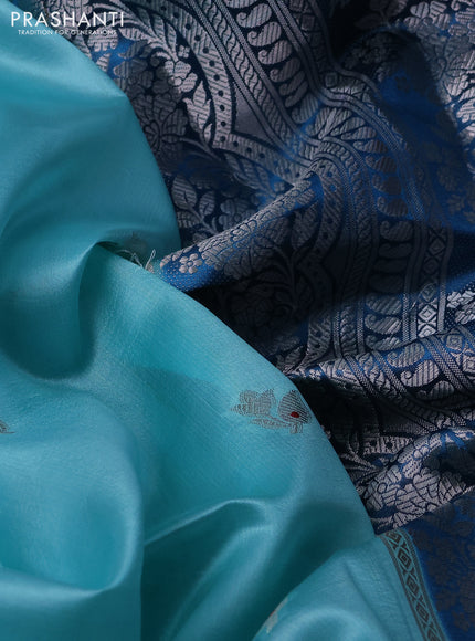 Banarasi poona silk saree teal blue and cs blue zari woven floral buttas and silver zari woven border