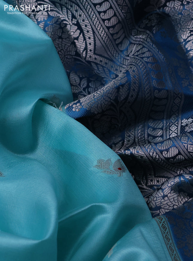 Banarasi poona silk saree teal blue and cs blue zari woven floral buttas and silver zari woven border
