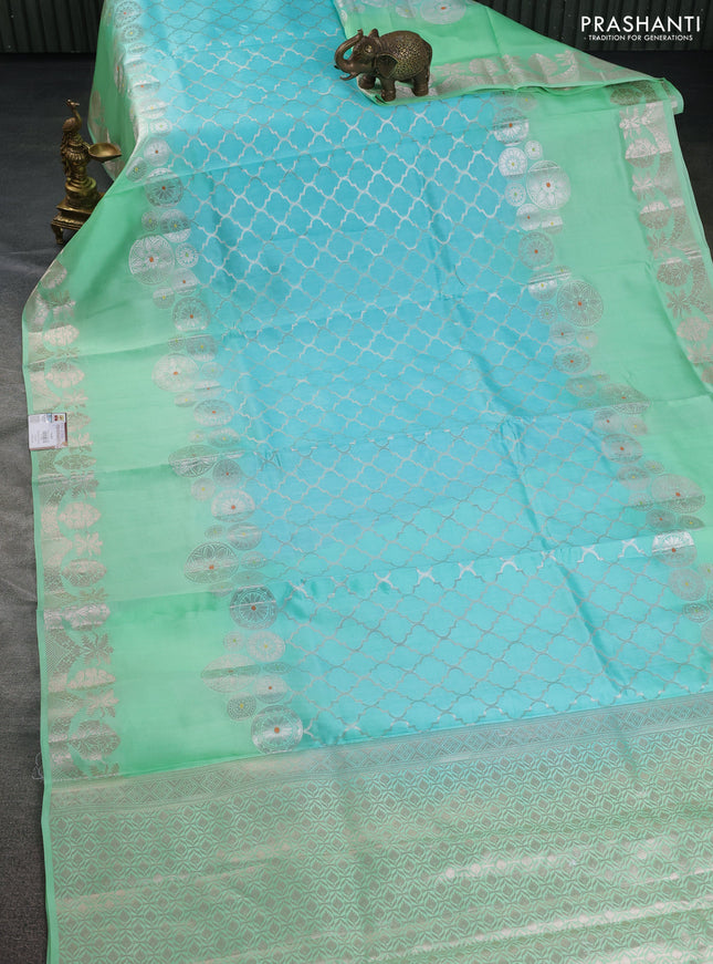 Banarasi poona silk saree light blue and teal green with allover zari woven geometric weaves and long zari woven border